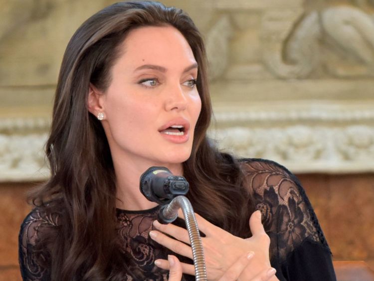 Hollywood star Angelina Jolie speaks to media during a press conference at a hotel in Siem Reap on February 18, 2017. Angelina Jolie will unveil her new film on the horrors of the Khmer Rouge era on February 18 at the ancient Angkor Wat temple complex in Cambodia, a country the star shares a deep affinity with through her adopted son Maddox. / AFP / TANG CHHIN SOTHY (Photo credit should read TANG CHHIN SOTHY/AFP/Getty Images)
