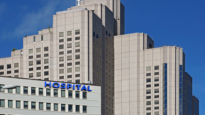 Buy a cash-strapped hospital, take on new risk